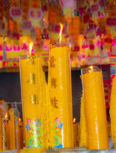 Wallpaper Mural A brightly colored candle in a Chinese Buddhist temple in Bangkok, Thailand. Torontodigital.ca