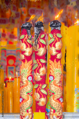 Wallpaper Mural A brightly colored candle in a Chinese Buddhist temple in Bangkok, Thailand. Torontodigital.ca