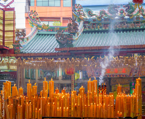 Wallpaper Mural A brightly colored candle in a Chinese Buddhist temple in Bangkok, Thailand. Torontodigital.ca