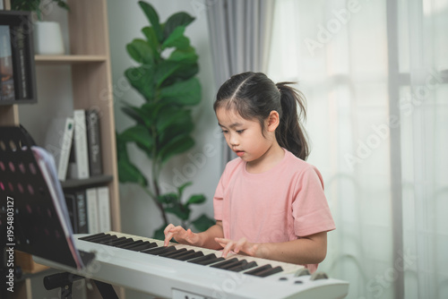 Young Girl Playing Keyboard at Home with Natural Light and Indoor Plants in a Cozy Living Room Setting
