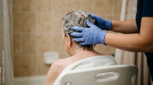 Compassionate caregiver assists an elderly person with hair washing in a home bathroom, emphasizing dedicated personal hygiene support and respectful senior care