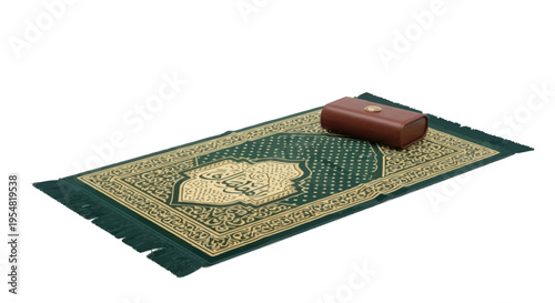 Ornate green and gold Islamic prayer mat with small wooden box.