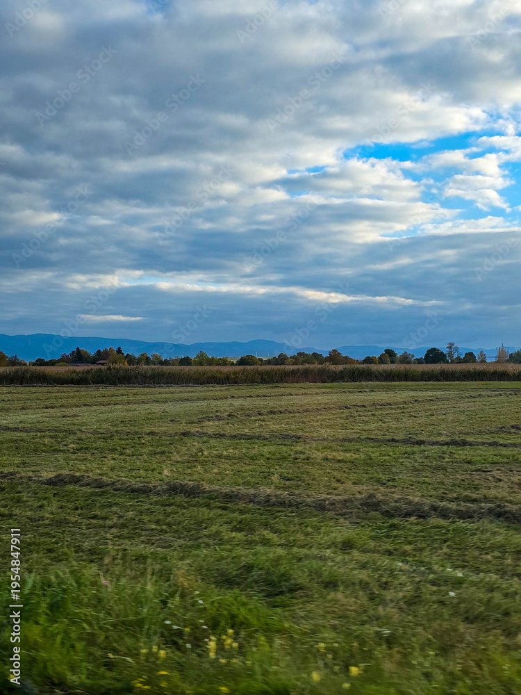 Fototapeta premium Dramatic Autumn Sky over a Mown Field