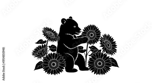 Black bear standing among flowers.