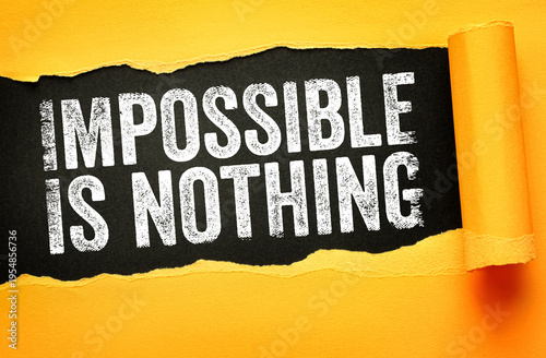Wallpaper Mural IMPOSSIBLE IS NOTHING inspirational phrase shown in a paper hole. Motivational concept for sports, goals, success, and overcoming challenges Torontodigital.ca