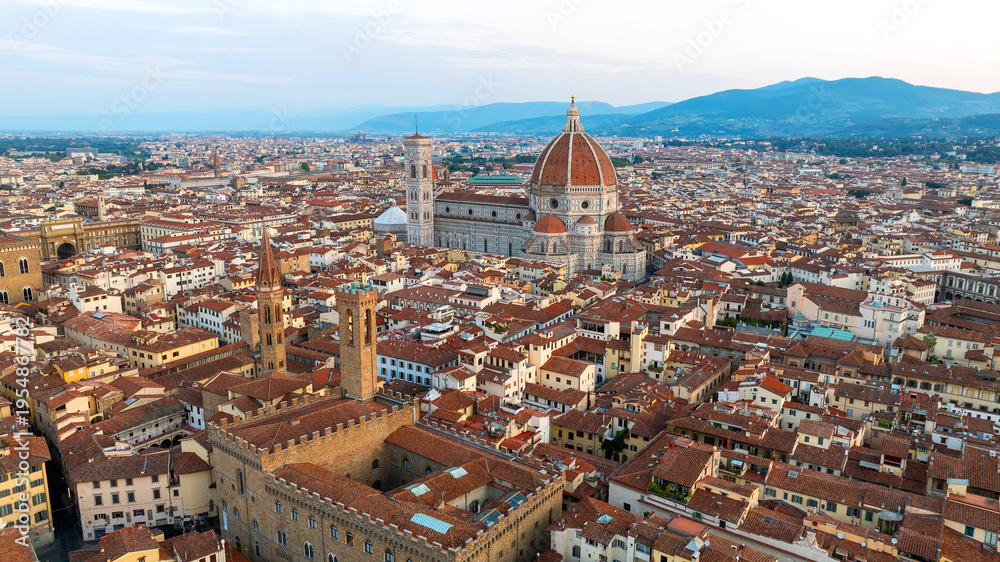 Fototapeta premium Aerial sunrise landscape Florence Italy. Scenic drone shot Duomo cathedral dome historic architecture summer. Renaissance landmark Tuscany travel destination world heritage city nature background.
