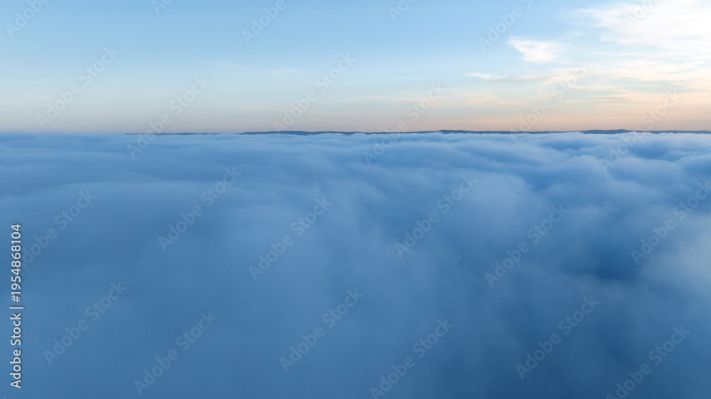 Fototapeta premium Panoramic aerial view above white clouds sun shining clear sky. Heavenly sunrise landscape high altitude drone flight. Meditation spirituality peace freedom inspiration concept nature scene.