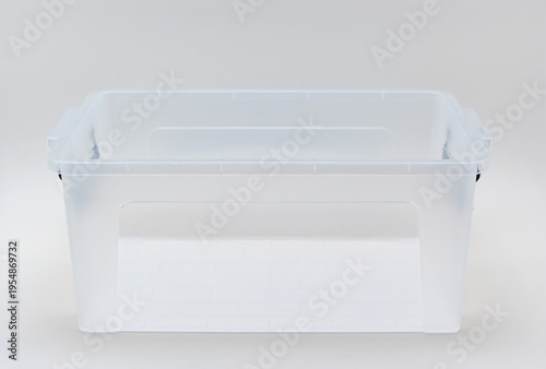 Clear storage bin on plain background for organization and display