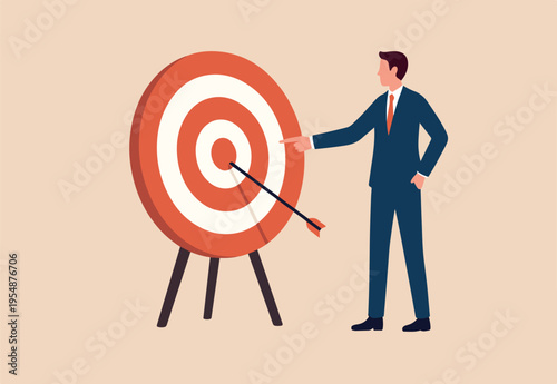 Specific goal, clarify objective or target, focus or concentrate on purpose to win business mission, perfection or aiming at target concept, businessman pointing at center of bullseye archery target