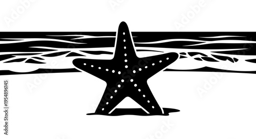 Black starfish on sandy beach.