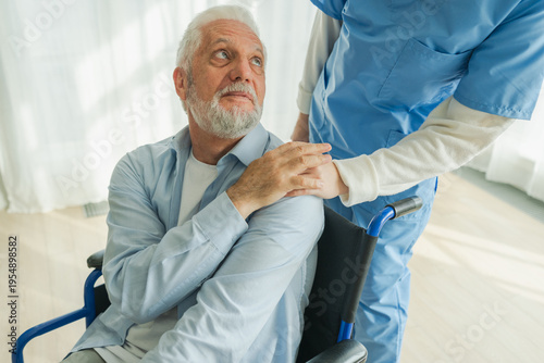 Help support retirement healthcare. Nurse helping old man in wheelchair. Patient and woman in nursing home for medical caregiver. Nurse taking care of paralyzed man in chair for people with disability