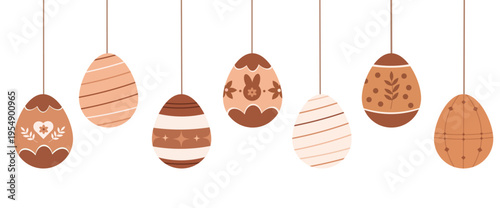 Hanging brown Easter eggs with minimal white ornaments and patterns on strings