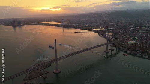 High-angle perspective of the bustling Cebu metropolis at dusk, showing the transition from daylight to glowing city lights