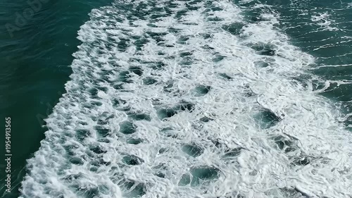 Dynamic Ocean Wave Crashing with White Foam in Turquoise Water, Aerial View