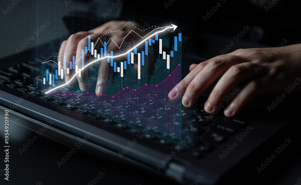 Fototapeta premium Detailed image showcasing hands typing on a laptop, enhanced by a stock market graph overlay indicating financial analysis and business growth in a professional setting. Impute