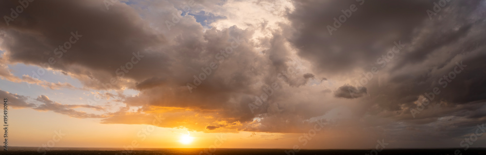 Fototapeta premium Heavy rain falling down from stormy clouds during thunderstorm on dark evening sky. Moving and changing cloudscape weather