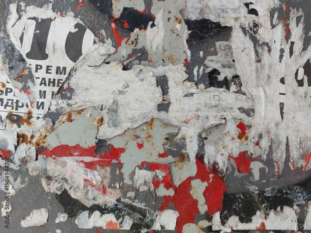 Fototapeta premium Torn and ripped street poster background, messy and old weathered paper details