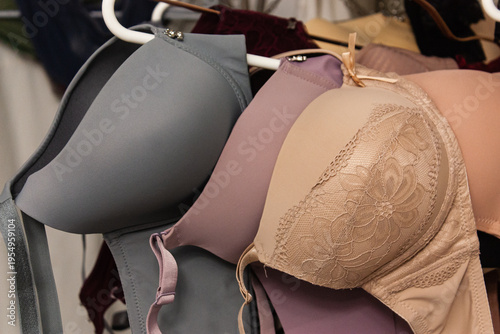 Close up shot of the different types of women push up bra hanging on the hangers. 