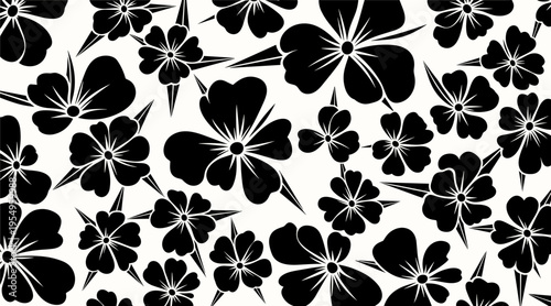 Floral silhouettes scattered across seamless black and white backdrop, no seamless