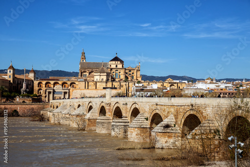 Cordoba city view. Roman Bridge and Mezquita (mosque-cathedral) on the Guadalquivir River.