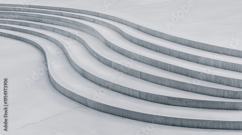 A series of concrete steps with a curved design.