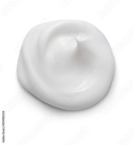 White swatch of squeezed cosmetic cream isolated on white background top view.