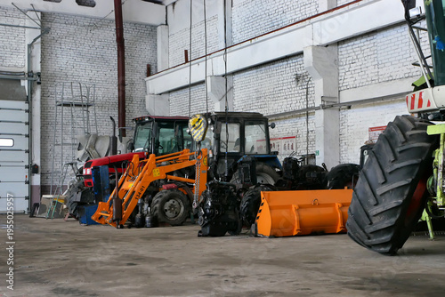 Tableau sur toile the agricultural tractors in the shop preparing for planting