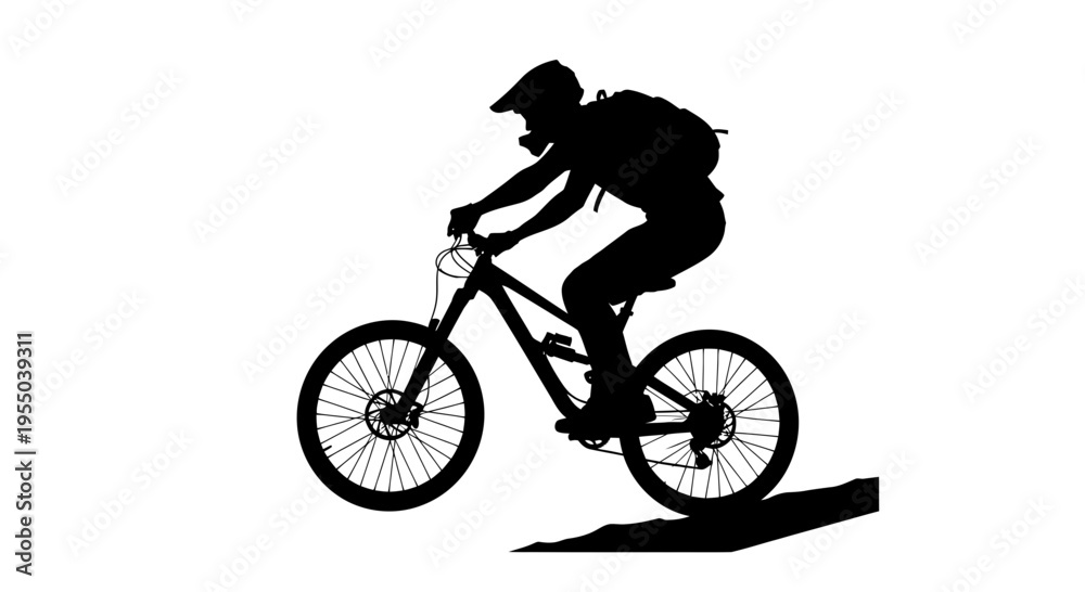 Fototapeta premium Silhouette of a Mountain Biker Jumping on a Trail