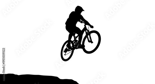 Silhouette of a Mountain Biker Jumping off a Cliff