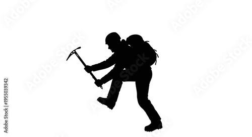 Silhouette of a mountaineer climbing with an ice axe