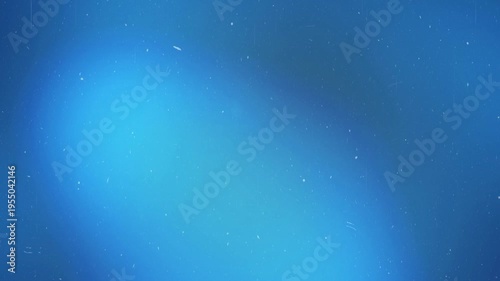 Blue light leak motion glow. Cinematic dreamy gradient background, Vibrant dynamic abstract overlay, bokeh, shimmer. Grainy film texture effect for transition, backdrop. Luminous flicker, dust, noise