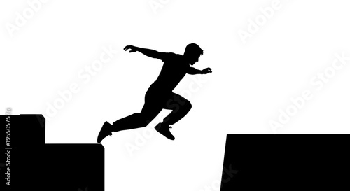 Silhouette of a man jumping between two platforms