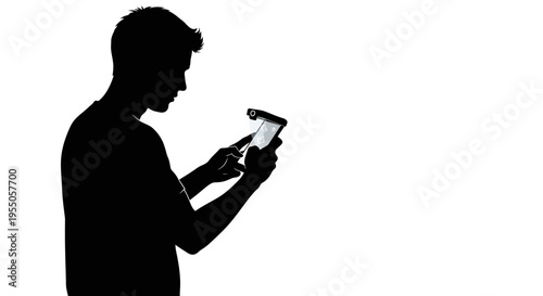 Silhouette of a man using a handheld mobile scanner device