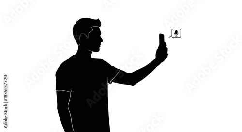 Silhouette of a man using voice command on a smartphone