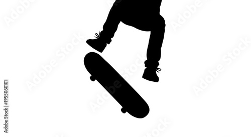 Silhouette of a Skateboarder Performing a Trick in Mid-Air