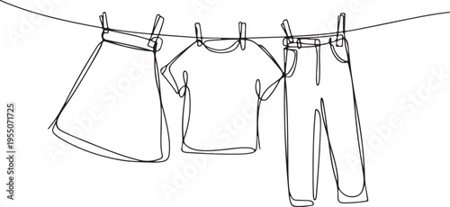 Clothes hanging on a clothesline in a single line drawing