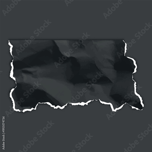 A rectangular piece of black crumpled paper with jagged bottom and side edges.