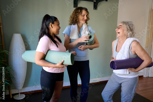 Diverse women friends talking after yoga class