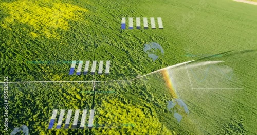 Center-pivot irrigation motor starting, spraying crops for farming while drone HUD displaying data