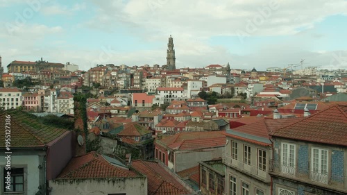 Beautiful porto portugal skyline with red top buildings, european style buildings and birds flying around