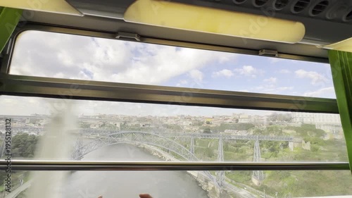 View from inside train of Porto portugal buildings and landmarks, dom luis bridge