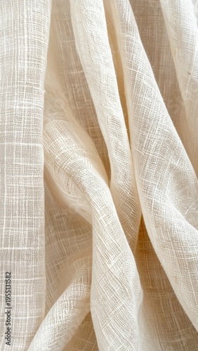 Cream Colored Textured Fabric Draped Softly With Subtle Light Shadows