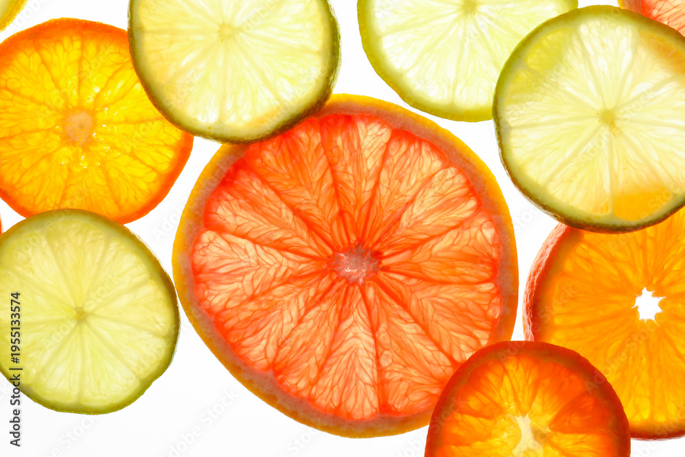 Fototapeta premium Slices of different juicy citrus fruits on white background, top view