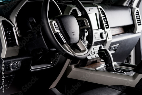 Fotografie New car interior with luxury details, automatic transmission and steering wheel