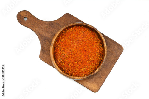 Cajun seasoning in a wooden bowl isolated on white background