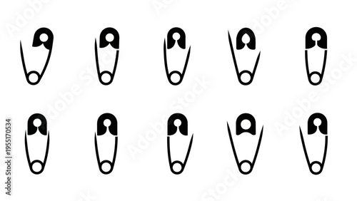 A collection of black safety pins.