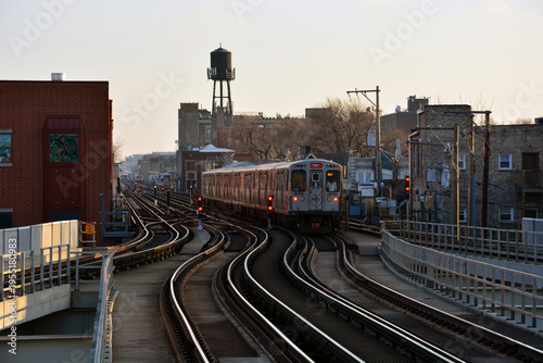 A commuter elevated train moves down the tracks from the Belmont Station in Chicago.