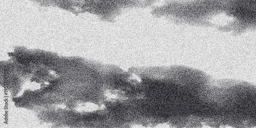 Abstract monochrome clouds with a grainy texture and dramatic lighting creating a moody atmospheric background for artistic and conceptual imagery