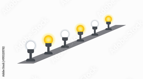 A row of lights on a ramp, alternating between lit and unlit.