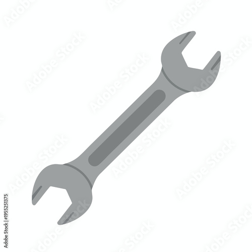 A simple, gray, open-ended wrench lies diagonally on a white background